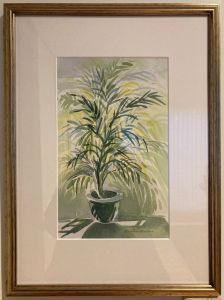 Photo of a framed watercolor painting by Kristin Malone featuring a small parlor palm in shades of green. The title is "Growth Spurt."   